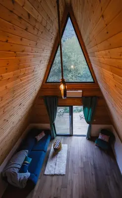 a room with a large window in a cabin at Cozy Glamping Cabin for Couples and Families in Arakapas