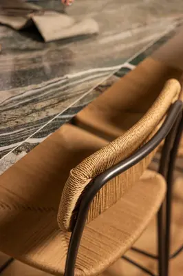 a wooden chair sitting in front of a table at Interlace by Holistays in Engomi