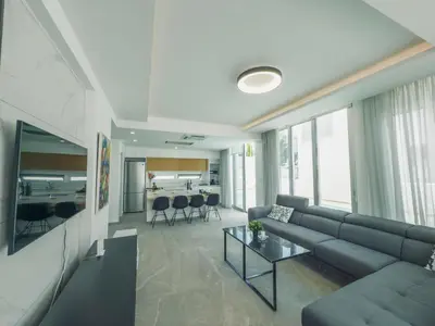 a living room with a couch and a table at Imperial Jade V4 - Villa Andriana in Protaras in Protaras