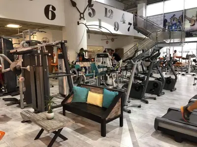 a gym with a bunch of tread machines at Ithaki Phinikoudes Apartment No. 205 in Larnaka