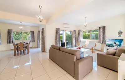 a living room with two couches and a table at Anthorina Greco Villa #18 in Protaras