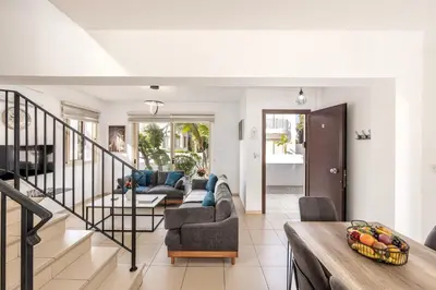 a living room with a couch and a table at villa Palms 31 in Protaras