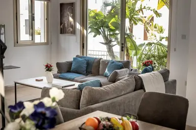 a living room with a couch and a table at villa Palms 31 in Protaras