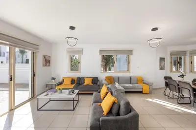 a living room with a couch and a table at Villa Palms 32 in Protaras