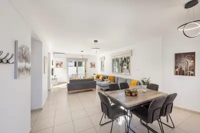 a living room with a table and a couch at Villa Palms 32 in Protaras