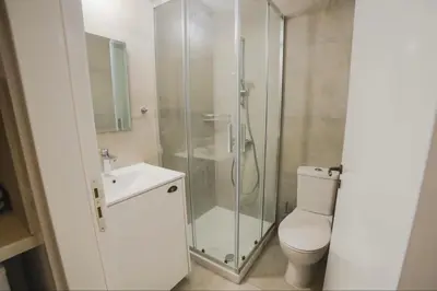 a bathroom with a shower and a toilet and a sink at Eftychia's House in Lofou
