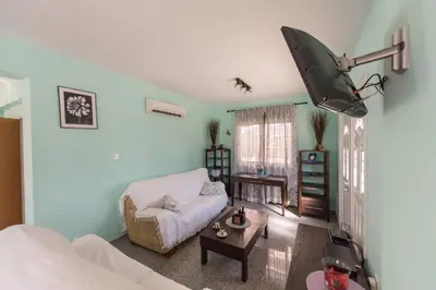 a living room with a couch and a table at Villa Marina in Ayia Napa