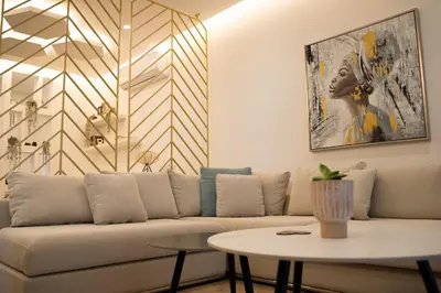 a living room with a couch and a table at Delightful 1st Floor Xanthippis Apartment in Strovolos