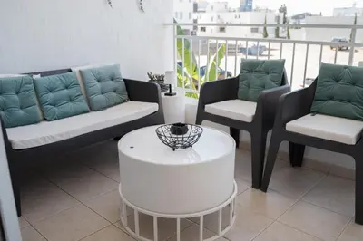 a living room with couches and a coffee table at Delightful 1st Floor Xanthippis Apartment in Strovolos