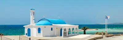 a small blue and white mosque on the beach at Nissi Si Lux Boho Apartment on Nissi beach in Ayia Napa