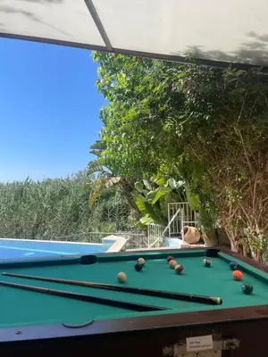 a pool table with balls on it in a yard at Gold Sand Villa in Protaras