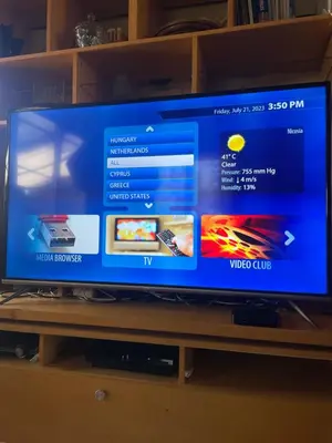 a flat screen tv sitting on top of a shelf at Gold Sand Villa in Protaras