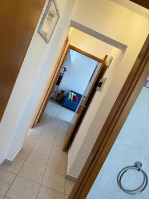 a hallway with a glass door leading to a living room at Green valley Tersefanou in Tersephanou