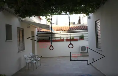a patio with chairs and a glass table at Modern spotless house with full privacy and WiFi in Aglantzia Nicosia in Aglantzia