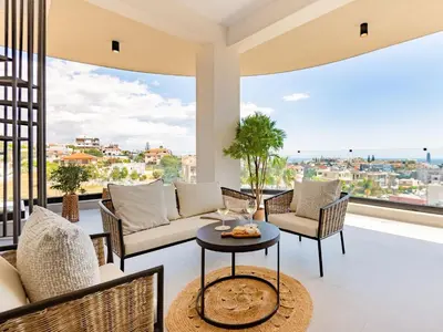 a living room with a couch and a table at Sanders Eduardovich Limassol in Limassol