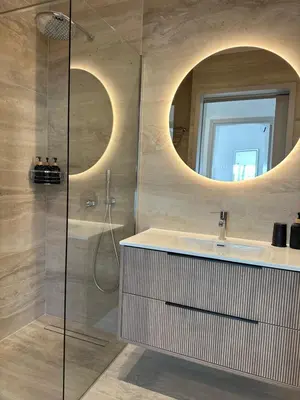 a bathroom with a sink and a mirror at Aurora Downtown Living in Nicosia