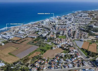 an aerial view of a city next to the ocean at Villa Maria in Protaras