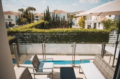 a view from the balcony of a house with a swimming pool at Jupiter Villa in Voroklini