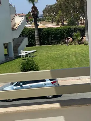 a car is parked on the side of a road at A sea breeze house in Larnaka
