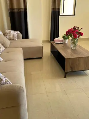 a living room with a couch and a coffee table at A sea breeze house in Larnaka
