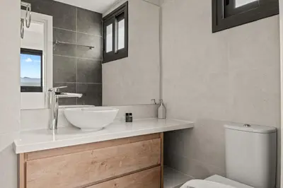a bathroom with a sink and a toilet at Serenity Waves Villa 20 in Larnaka