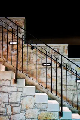 a set of stairs with a black rail at Vouni Calais in Vouni