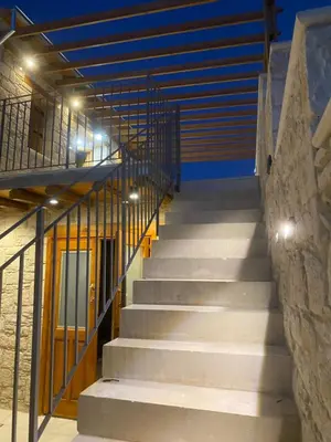 a set of stairs in a building with lights at Vouni Calais in Vouni