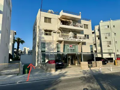 a building with a car parked in front of it at 1 bedroom flat 200m from beach in Limassol