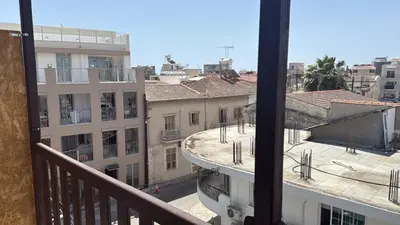 a view of a city from a balcony at Unique City Center Rooms, 150m from Chabad Lubavitch in Larnaka