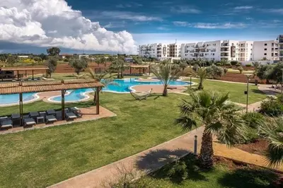an aerial view of a resort with a swimming pool at North Cyprus Thalassa beach resort in Paralimni