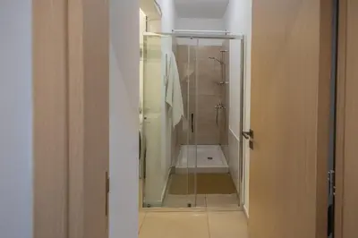 a bathroom with a shower with a glass door at Lap of luxury in Limassol