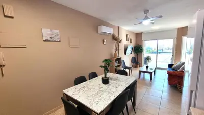 a dining room with a table and chairs at 5 Min Walk to Beach, Perfect Seaside Escape in Larnaka