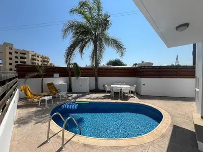 a swimming pool on the roof of a building at Amour Et Citrons in Protaras