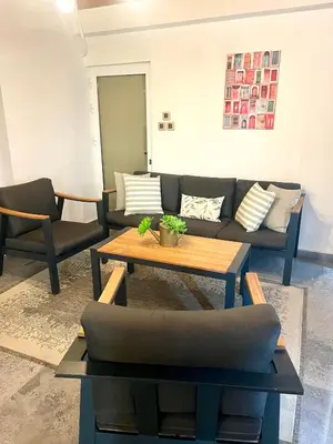 a living room with a couch and a coffee table at Sea View Penthouse in Larnaka