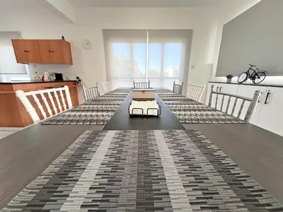 a living room with a table with a bed on it at Albert's Apartment Center 101K in Larnaka
