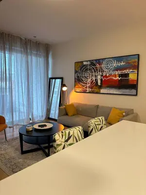 a living room with a couch and a table at Lux Hub Spot-Νear European Uni Engomi in Nicosia