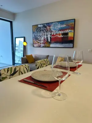 two wine glasses sitting on top of a table at Lux Hub Spot-Νear European Uni Engomi in Nicosia