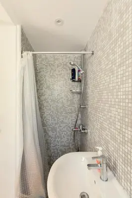 a bathroom with a sink and a shower at Family Fig Tree Bay House in Protaras