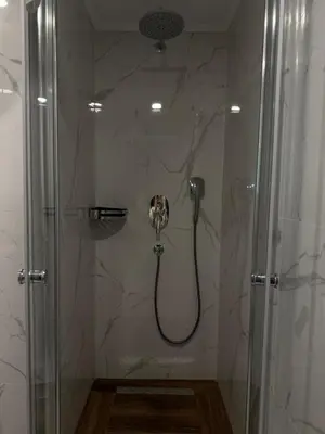 a shower in a bathroom with a glass door at Grand sapphire resort Ötüken yeni iskele North Cyprus in İskele