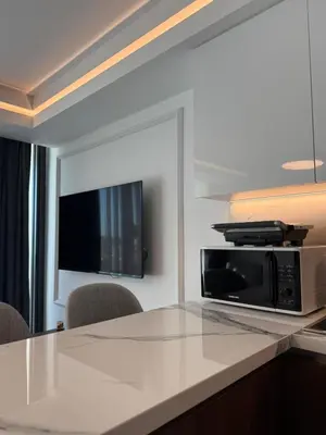 a microwave sitting on a counter in a room at Grand sapphire resort Ötüken yeni iskele North Cyprus in İskele