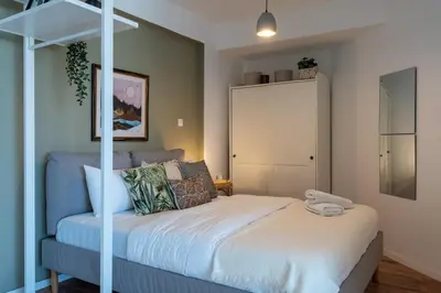 a bedroom with a bed with a white bed frame at Luna - Homely Studio W Balcony in Larnaca in Larnaka