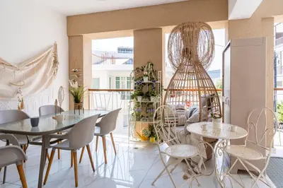 a dining room with two tables and chairs at Infinity - One-Bedroom Apt W Terrace in Larnaca in Larnaka