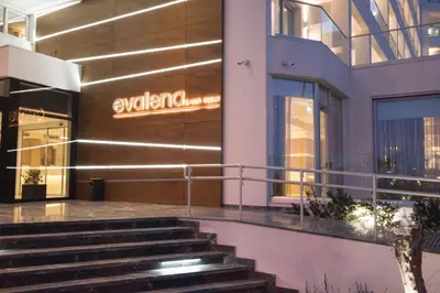 a building with stairs in front of a store at Evalena Beach Hotel in Protaras