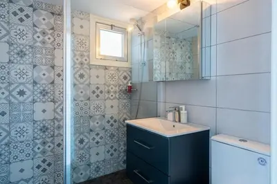 a bathroom with a sink and a mirror at Liric - 3 Bedroom Apt W Balcony in Larnaca in Larnaka
