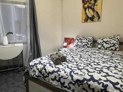a bedroom with a bed with a teddy bear on it at two-room apartment center in Limassol