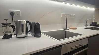 a kitchen with a counter top with a sink at STAY City Center Gem in Nicosia