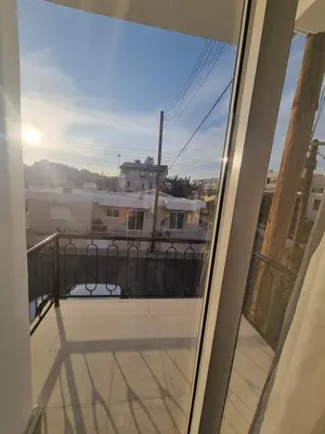 a balcony with a view of a building at Jacobs home in Larnaka
