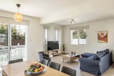 a living room with a couch and a table at Protaras Villa Cemelia in Protaras