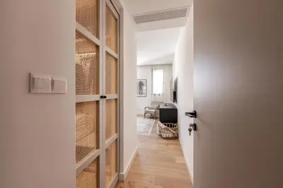 a hallway with a door leading to a living room at Elysium Heights in Nicosia