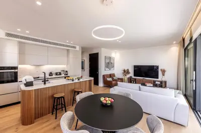 a living room with a couch and a table at Elysium Heights in Nicosia
